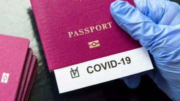 COVID-19 coronavirus pandemic and travel concept, COVID-19 note in passport. Novel corona virus outbreak, spread of epidemic from China.